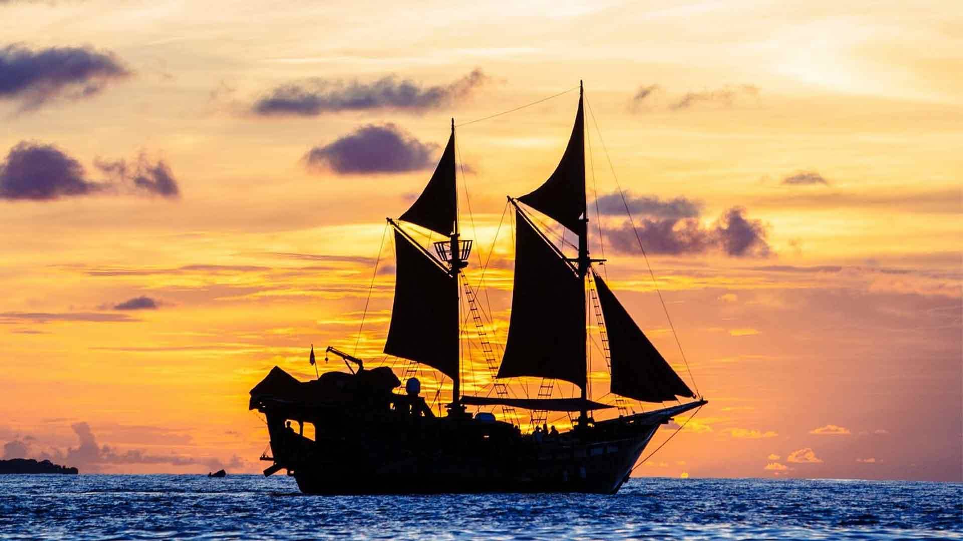manta mae boat sailing in the sunset